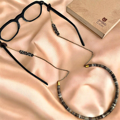 CUELGA GAFAS RAICES
